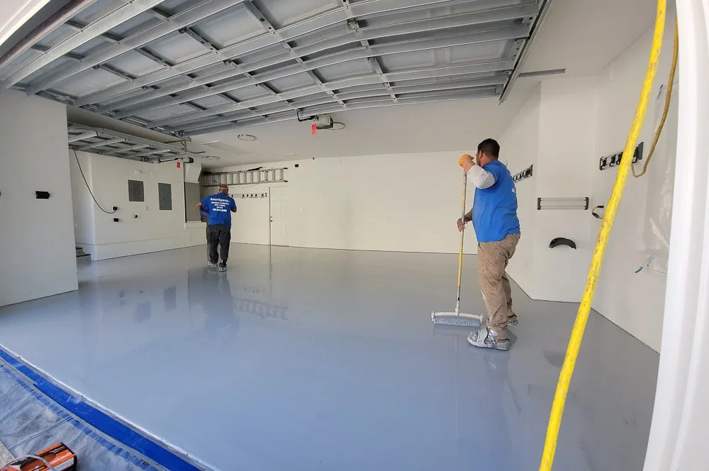 Real Orlando garage epoxy install — finished gray topcoat