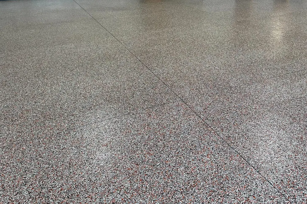 Metal shop building red flake epoxy floor