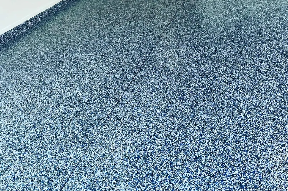 Blue and white flake garage floor with cove base Orlando