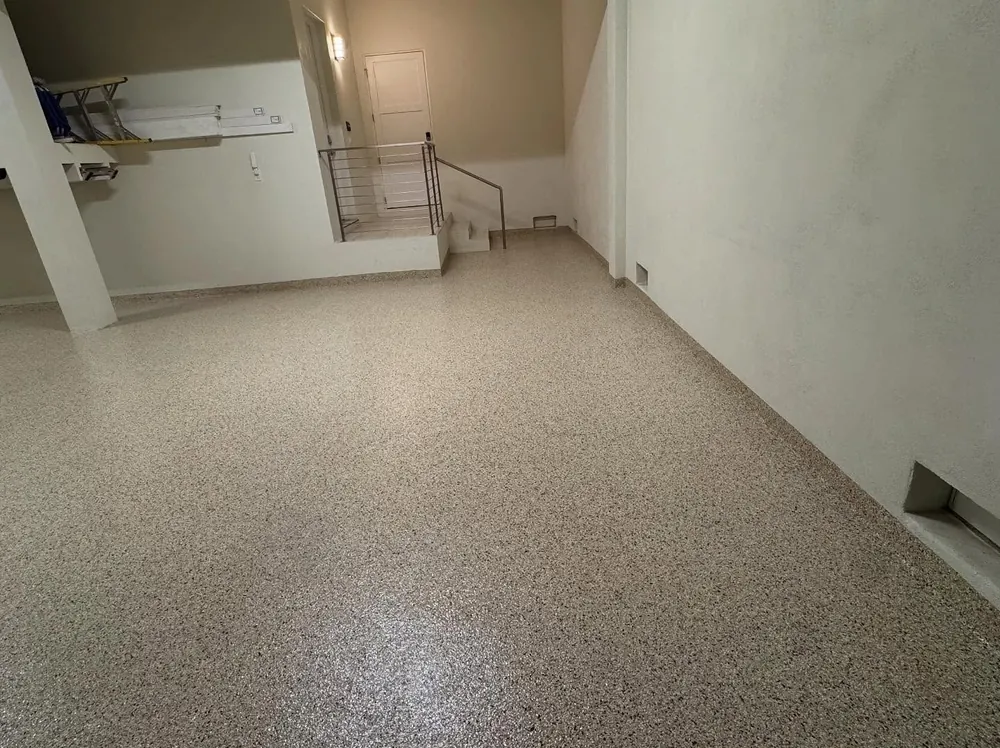 Lower-level garage tan flake epoxy floor Orlando